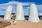 People at the sculpture La Mano in Punta Del Este, Uruguay.