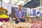 people sell their fresh fruits and vegetables at the outdoor market in Bikaner, India