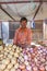 people sell their fresh fruits and vegetables at the outdoor market in Bikaner, India