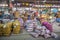 people sell vegetables, flowers and spices at the night market Pak Khlong Talat in Bangkok