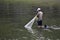 The people of Semarang city spend a lot of time in the afternoon looking for fish in the flooded rivers of the West Canal