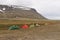 People set tents for a camp near Longyearbyen, Norway.