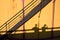 People shadows on old metal tanks in power plant,