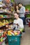 People shelves with canned goods