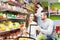 People shelves with canned goods