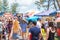 People shopping at festival stall on outdoor fair in Byron Bay, NSW, Australia