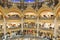 People shopping in luxury Lafayette galeries of Paris, France