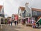 People and shops in main street Haven in Volendam, Noord-Holland, Netherlands