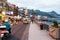 People, shops on waterfront in Giardini Naxos