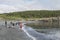 People on the shore of Logy Bay Catch Capelin