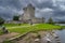 People sightseeing and visiting beautiful, 15th century Ross Castle near Lough Leane