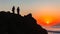 People Silhouetted Watching Ocean Sunrise