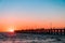 People silhouettes on Port Noarlunga jetty at sunset