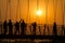 People silhouettes on the sunset on Lakshman Jhula bridge