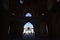 People silhouettes under the arch of mosque in Iran. September 12, 2016