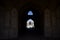 People silhouettes under the arch of mosque in Iran. September 12, 2016