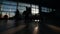 People silhouettes walking on the airport hall