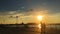 People silhouettes walking on quay