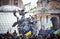 People sit on the monument decorated with flags during revolution in the Ukraine