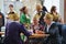 People sit together, at a parochial festivity in the countryside. Austria.