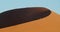 People are sitting all over the huge sand dune in Namib desert, 4k