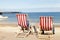 People sitting in deckchairs at Llandudno seaside holiday resort