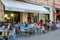 People sitting in Ferrari bar on Luigi Ferrari square in Rimini