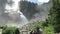 People sitting at Krimml Waterfalls. Located at Krimmler Achental - Krimml Achen valley in Austria