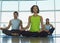 People Sitting In Lotus Position At Gym