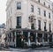 People sitting outside The Mitre pub in Lancaster Gate, London, UK