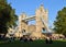 People sitting in Potters Fields Park next to Tower Bridge, London