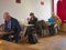 People sitting in the Red Kite Cafe at Cadzow Place in Edinburgh taking advantage of the free WIFI while drinking and eating.