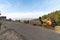 People sitting on roadside barriers in the Himalayan village of Kausani in Uttarakhand