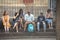 People sitting on the steps of a church