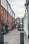 People sitting at the tables just outside the Mani\\\'s Cafe on Perrin\\\'s Court in Hampstead, London, UK