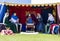 People sitting in tent. Medieval Display. Warkworth, Northumberland. England. UK.