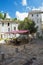 People sitting on a terrace on a square in the small village Saint Montan in the Ardeche region of France.