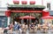 People sitting in a traditional French cafe Les Petits Carreaux on Rue Montorgueil street in Paris, France.