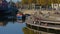 People sittingg and relaxing on a quay along river Lys in Portus Ganda, Ghent