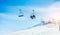 People on ski lift in winter ski resort - Holidays, snow gear renting, skiing, snowboarding and mountain landscape concept - Focus