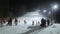 People skiing at night