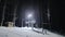 People skiing at night