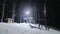 People skiing at night