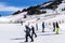 People skiing and snowboarding in Slopes of Grandvalira ski resort in Andorra