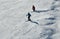 People skiing on snowy hill at Breckenridge ski resort.