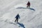 People skiing on snowy hill at Breckenridge ski resort.