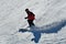 People skiing on snowy hill at Breckenridge ski resort.