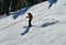 People skiing on snowy hill at Breckenridge ski resort.