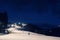 People skiing on snowy piste at night. Winter