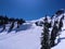 People skiing on white snow slope ski run